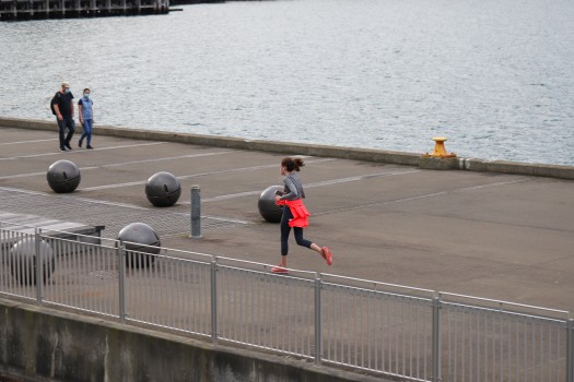 Female runner on the wharf