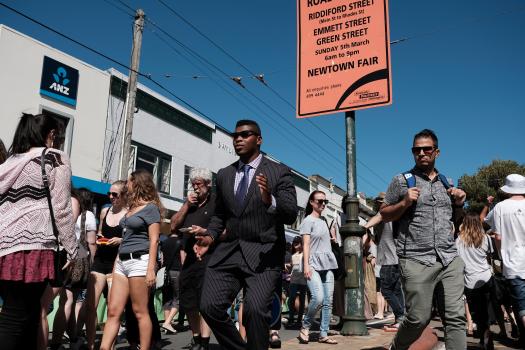 Dark skinned man in a suit at Newtown festival 2021