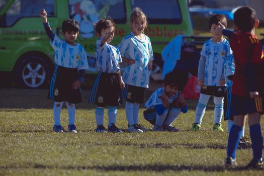Teammates lineup at Little Dribblers football match