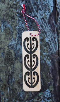 Wooden bookmark with mangopare symbol