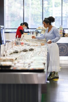Woman picking something from the food table