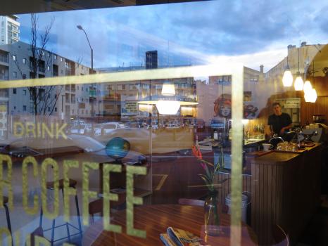 Reflection on glass and view inside coffee shop
