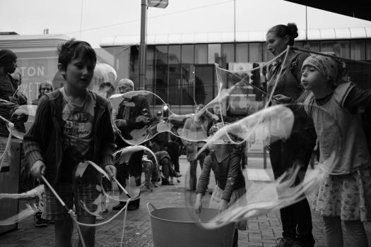 Kids making bubbles B&W