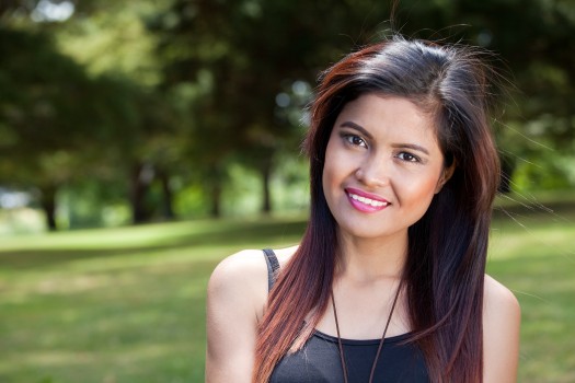 Portrait of attractive Asian woman in park