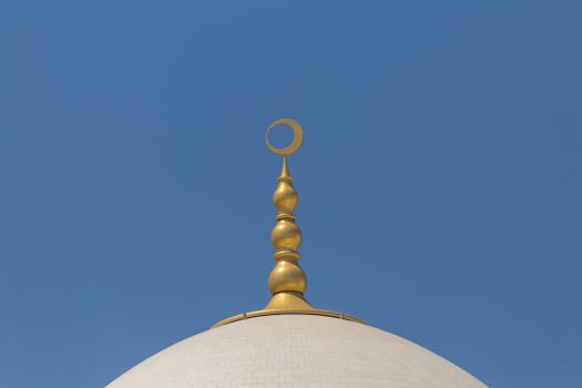 Golden crescent moon atop the dome