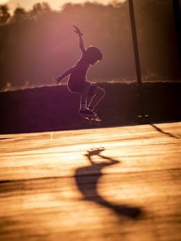 Skateboarding Child Jump Trick Light