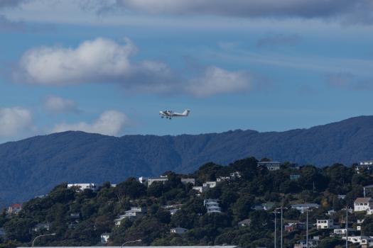 Small aircraft taking off over the city of Wellington