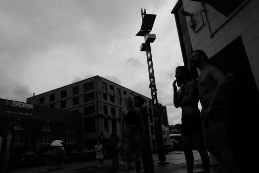 Monochrome image of people in the street