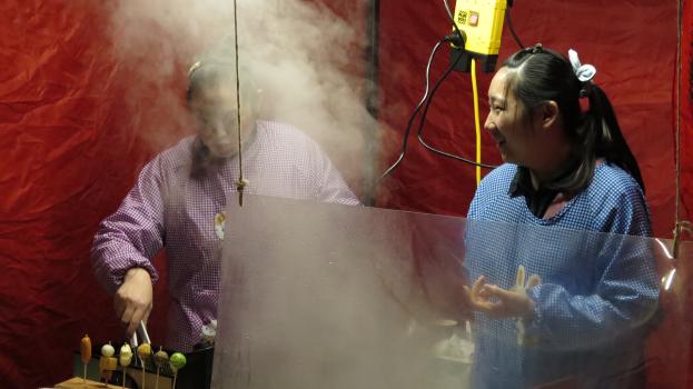 Steam from making street food