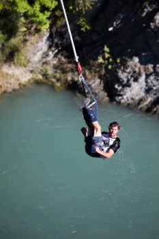 Male tourist bungy jumps near Queenstown
