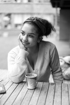 Black and white portrait of a lady with coffee