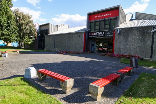 Red benches outside musem (Whare Toi)