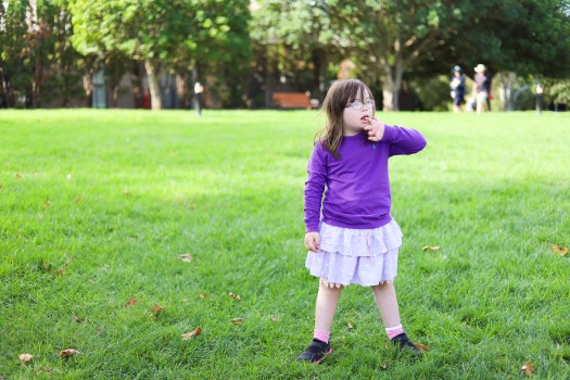 Girl with Down syndrome in a park