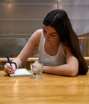 Young woman studying alone