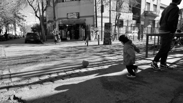 Child with football in Buenos Aires