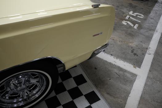 Classic cream Plymouth Commando V8 front fender and wheels