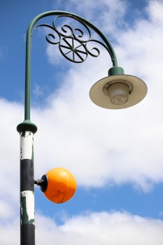 Circular and round light fixtures on a pole