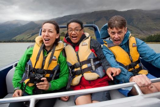 3 Kiwi friends enjoy jet boat on river, Otago