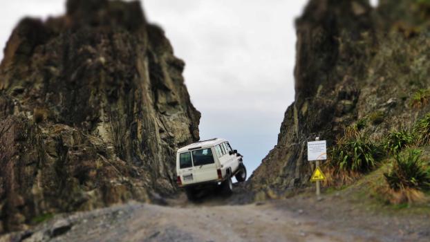 Toyota land cruiser 4x4 4wd on a narrow passage at Owhiro Bay