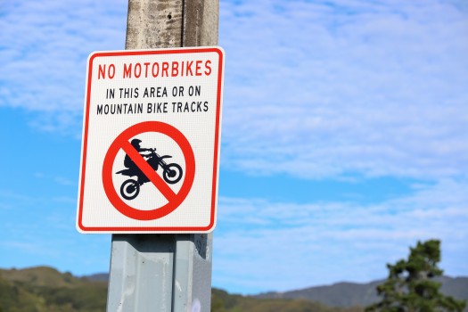 'No motorbikes' sign on pole