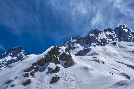 Ski tourers climbing above Sefton Biv
