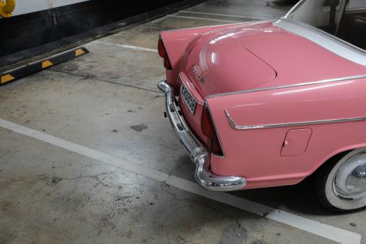 Pink classic car rear fender trunk and wheel