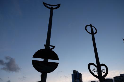 Symbols on posts at sunset