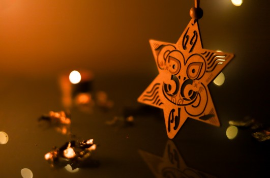 Waiti Matariki star ornament in yellow light