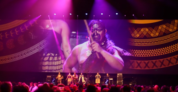 Māori tāne with Tā moko on stage