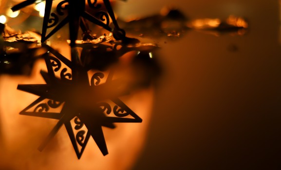 Matariki star ornament on reflective surface