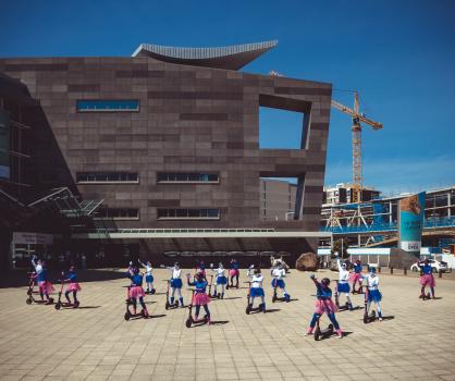Flamingo scooter ballet in front of museum of New Zealand