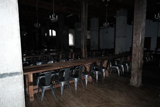 Mess hall with table and chairs at a distillery