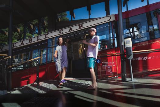 Man and woman performing in a cable car station - The Metamorphosis Artists