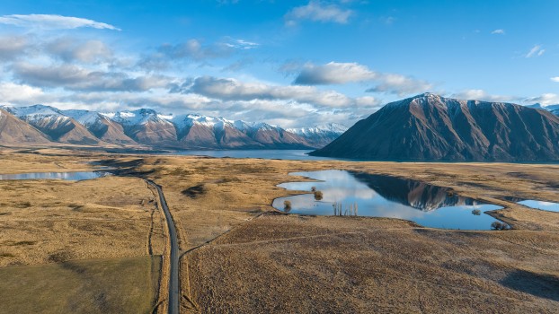 Drone perspective of the road out to Lake Ohau