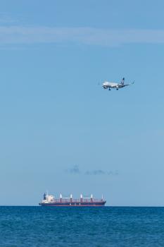 MUR cargo ship and AIR NZ plane over water