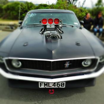 Classic supercharged black Ford Mustang at Port Road drag racing event