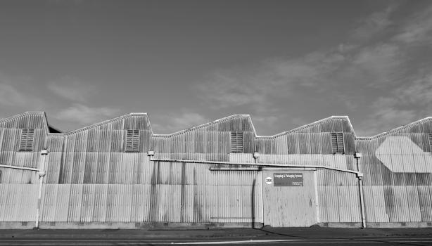Slanted roof buildings at Hawkes bay black and white