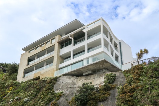 Building's balconies on rock's edge