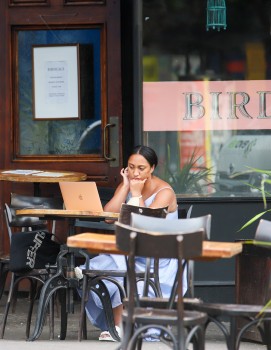 Woman working on her computer at a cafe