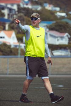 Referee with neon Nike scrimmage vest pointing with finger - Sports Zone sunday league