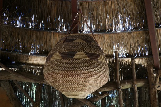 Hand woven basket hanging from the ceiling