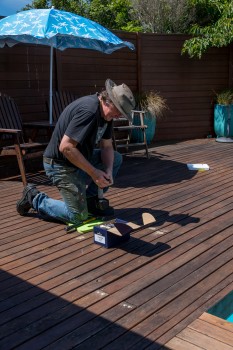 Man fixing a deck