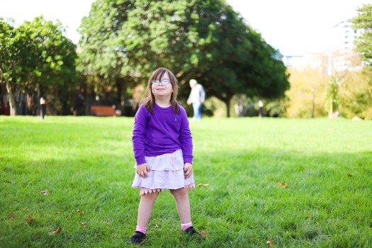 Girl with Down syndrome enjoying at the park