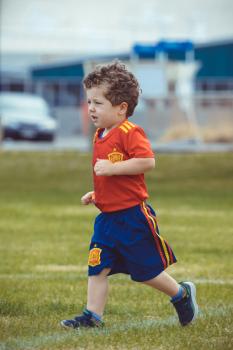 Boy in Spanish kit at Little Dribblers football game