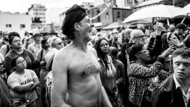 Laughing man with shirt off at Cuba Dupa 2021 monochrome
