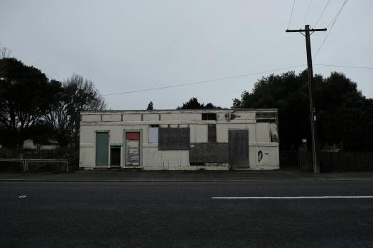 Abandoned building at the side of the road