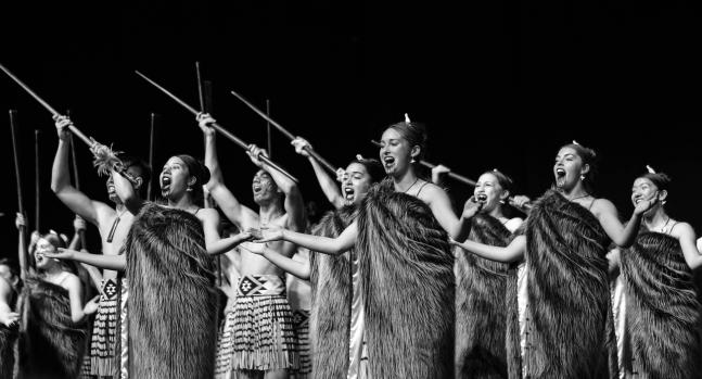 College group performing cultural Kapa Haka black and white