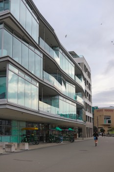Glass facade building facing marina