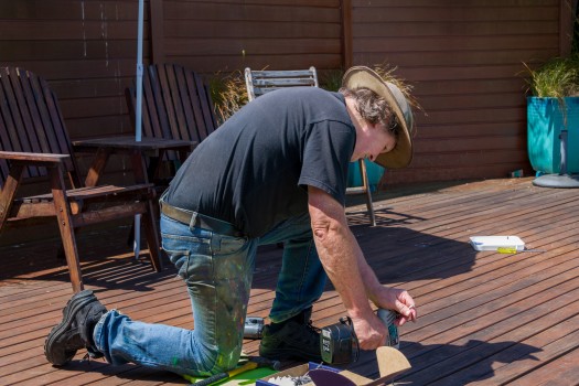 Man fixing a deck 