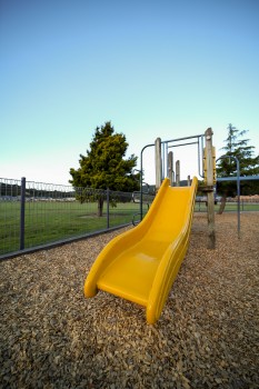 Yellow slide at a playground